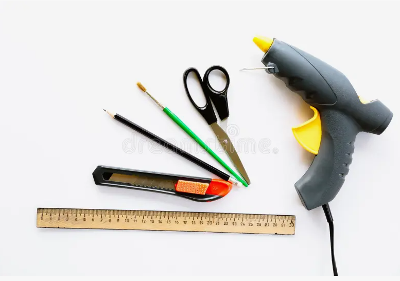 Essential Craft Tools: A Complete Guide for Beginners Essential Craft Tools including scissors, ruler, craft knife, pencils, paintbrushes, and hot glue gun for DIY projects