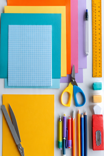 Basic Craft Materials: A Beginner’s Guide to Essential Craft Supplies Basic craft materials for cutting projects with scissors, ruler, paper, pencils, and cutting mat.
