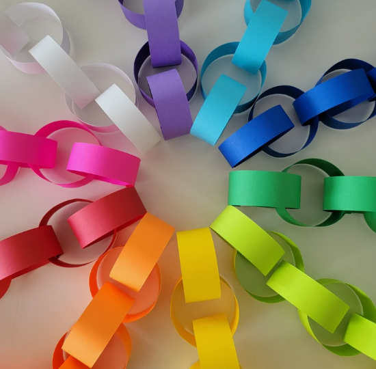 A vibrant circle of easy paper crafts made from interconnected colorful paper chains.