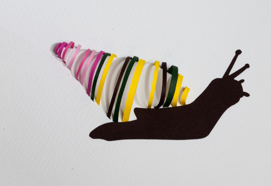 An imaginative example of easy paper crafts featuring a dark silhouette of a snail with a colorful striped shell made from paper strips.