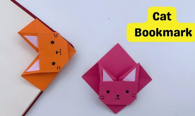 Handmade origami cat corner bookmarks in orange and pink, created as part of easy paper crafts.