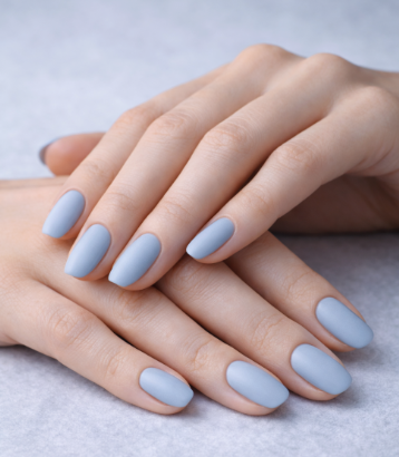 What nail colour is trending now showcased as a smooth, matte pastel blue finish on short, neat square nails.