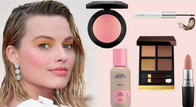 10 Makeup Trends for 2026: The Beauty Looks Everyone Will Want to Try A portrait of actress Margot Robbie showcasing makeup trends 2026 with vibrant yellow eyeshadow, flushed pink blush, and natural lips, displayed alongside a collection of beauty products.