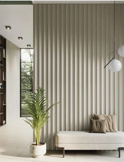 Minimalist hallway embodying interior design trends 2026, featuring vertical fluted wall paneling, a sleek upholstered bench, and modern globe pendant lighting.