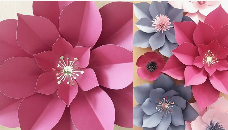 15 Easy DIY Paper Flowers for Kids: Fun Crafts for Toddlers, Preschoolers & Older Children A collection of elegant handmade paper flowers featuring large pink and white layered blooms for easy paper flowers for kids.