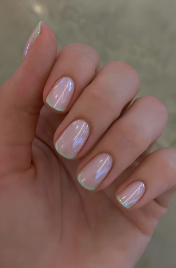 25 Short Fall Nail Ideas for 2026: Chic, Simple & Trendy Designs Short fall nail ideas 2026 showcasing short, glossy pearlescent nails with thin pastel green French tips.