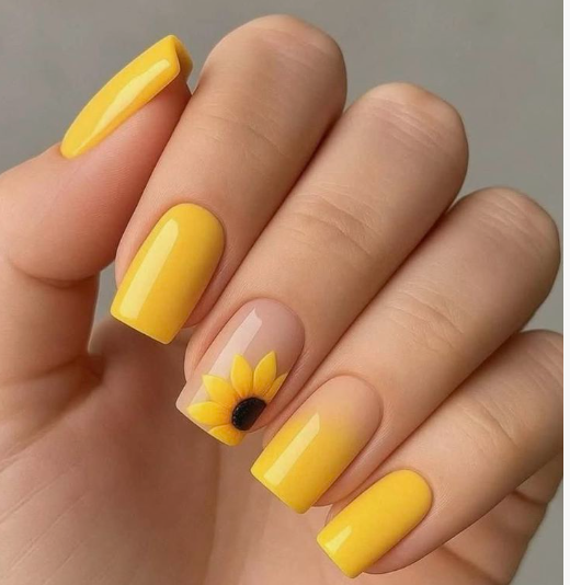 24 Sunflower Nail Ideas for a Bright, Cheerful Manicure sunflower nail ideas featuring a mix of solid bright yellow nails and an ombre yellow gradient nail, complemented by a single accent nail showcasing a textured yellow and black sunflower on a nude base.