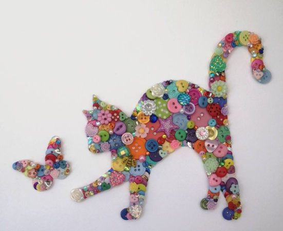 30 Creative DIY Button Crafts to Turn Spare Buttons Into Beautiful Decor A delightful wall art piece featuring a sitting cat silhouette meticulously crafted from a colorful assortment of buttons, showcasing DIY button crafts.