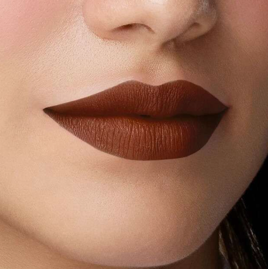 Matte Lipstick Styles in 2026: Modern Looks, Shades & Easy Tips Close-up of lips showcasing rich chocolate brown matte lipstick with a clean, velvety finish.
