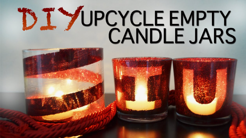 "Upcycled glass candle jars decorated with red glitter and glowing tealights, showcased as part of 25 easy DIY home decor crafts for cozy ambient lighting."