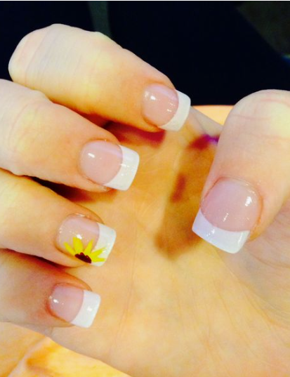 24 Sunflower Nail Ideas for a Bright, Cheerful Manicure sunflower nail ideas featuring classic square-shaped nails with a natural nude base and clean white French tips, highlighted by a single accent nail showcasing a bright yellow sunflower design painted near the tip.