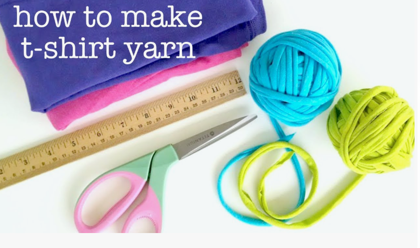 20 DIY Crafts With Old Clothes That Are Easy to Make A flatlay tutorial showing how to make t-shirt yarn with folded t-shirts, a ruler, scissors, and balls of yarn, demonstrating clever DIY crafts with old clothes.