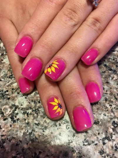24 Sunflower Nail Ideas for a Bright, Cheerful Manicure sunflower nail ideas featuring vibrant hot pink square-shaped nails with accent nails showcasing painted yellow sunflowers.