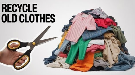 20 DIY Crafts With Old Clothes That Are Easy to Make A large pile of colorful old clothes next to a hand holding scissors, showcasing creative DIY crafts with old clothes and upcycling ideas.