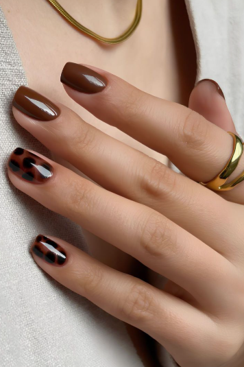 Brown nail ideas for short nails featuring glossy solid brown polish paired with chic tortoiseshell and animal print accent designs on short square nails