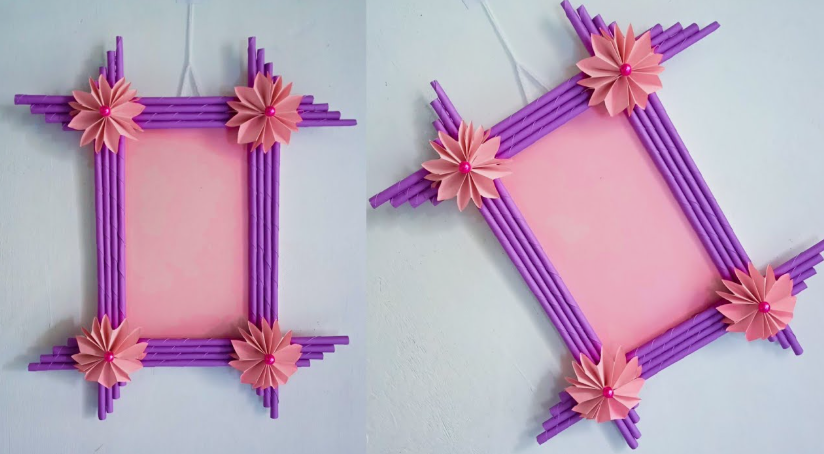Two views of a handmade rectangular picture frame crafted from rolled purple paper tubes, featuring a pink backing and decorated with pleated pink paper flowers at the corners.