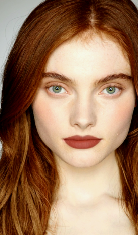 Matte Lipstick Styles in 2026: Modern Looks, Shades & Easy Tips Close-up of lips showcasing rich chocolate brown matte lipstick with a clean, velvety finish.