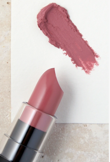 Matte Lipstick Styles in 2026: Modern Looks, Shades & Easy Tips Product flat lay featuring an open mauve-pink matte lipstick bullet positioned next to a matching creamy swatch on white paper.