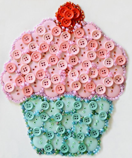 30 Creative DIY Button Crafts to Turn Spare Buttons Into Beautiful Decor A charming cupcake wall art design intricately handcrafted from pink, mint green, and red buttons accented with sparkling seed beads, highlighting DIY button crafts.