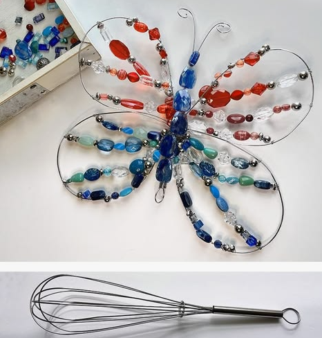 20 Recycled Household Item Crafts for a Creative Home A recycled household item craft featuring a butterfly sculpture made from a repurposed wire whisk, shaped wire wings, and colorful red, clear, and blue beads.