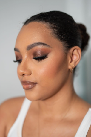 Model showcasing rich bronze and brown smokey eye makeup as part of Fall 2026 Beauty Trends.