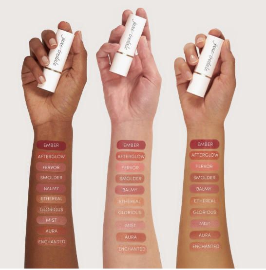 Three arms displaying lipstick shade swatches ranging from Ember to Enchanted to highlight Fall 2026 Beauty Trends.