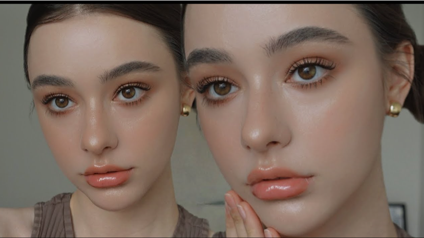 Close-up of a model showcasing dewy skin, defined brows, and glossy peach lips reflecting Fall 2026 Beauty Trends.