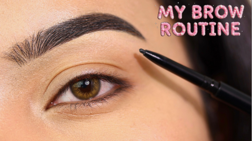 Low Maintenance Beauty Routine: A Simple 5-, 10-, and 15-Minute System A close-up shot of a well-groomed eyebrow and eye, with an eyeliner pencil held near the brow, highlighting the detailed steps of a low maintenance beauty routine under the text "MY BROW ROUTINE."