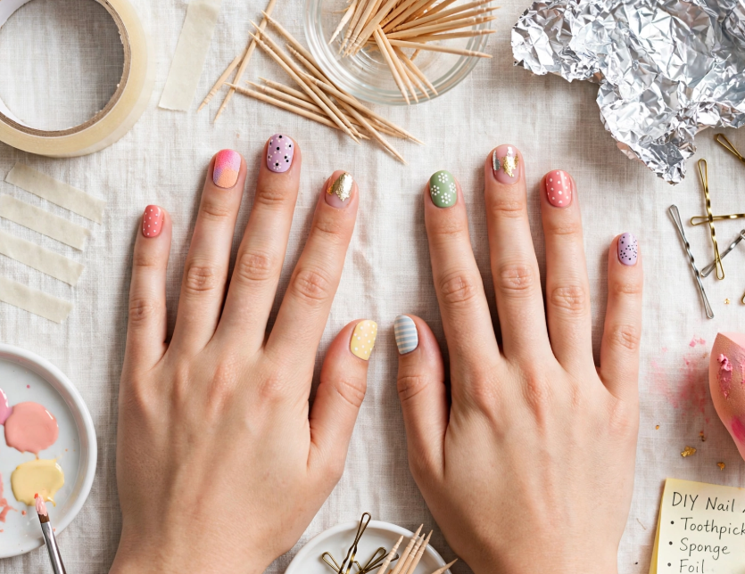 15 Nail Art Designs Using Household Items Creative nail art using household items like toothpicks, tape, bobby pins, and foil on pastel manicured hands.
