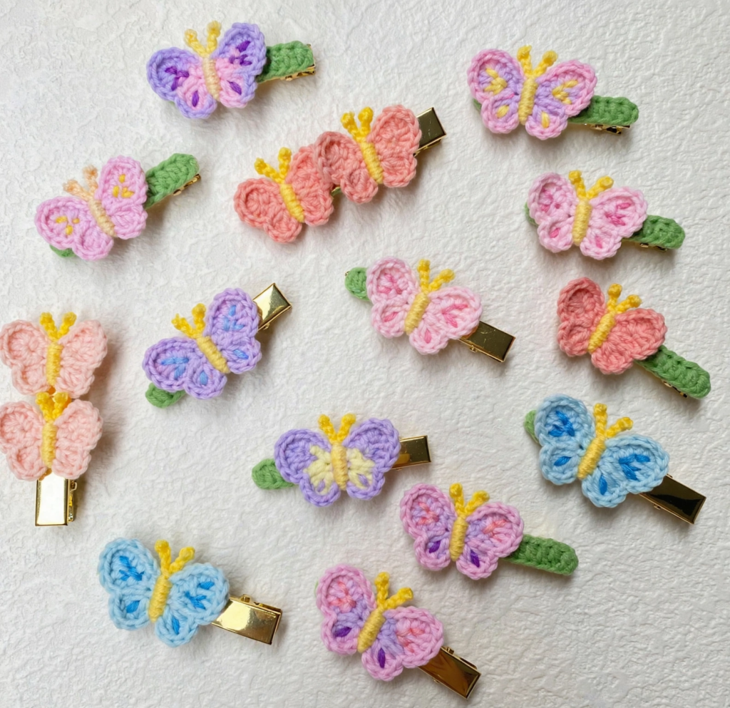 25 Craft Ideas for Teens That Are Actually Cool Handmade crochet butterfly hair clips on gold alligator barrettes, showcasing creative craft ideas for teens.