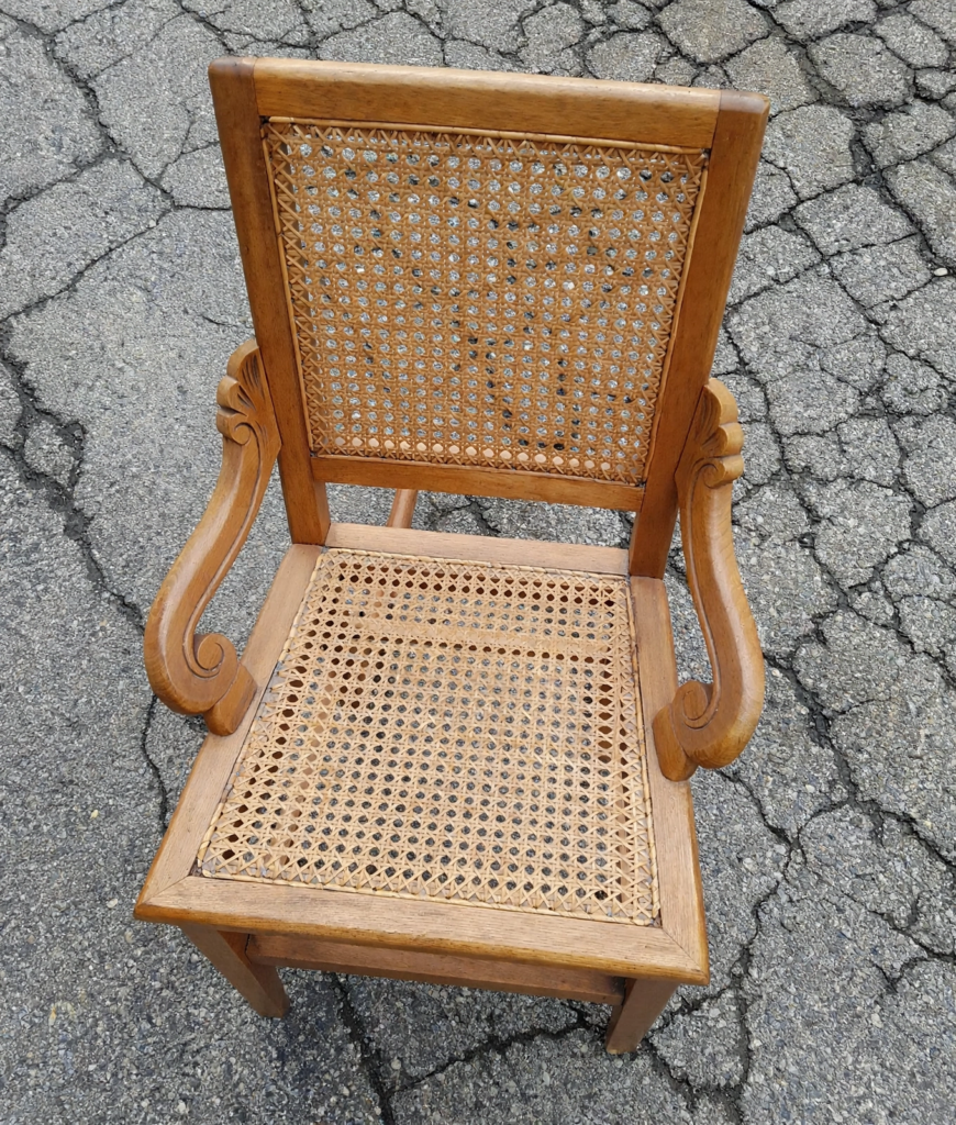 20 Nostalgic Crafts Making a Comeback in 2026 Vintage wooden armchair featuring intricate woven cane webbing on the backrest and seat, showcasing nostalgic crafts 2026 furniture restoration and caning ideas.