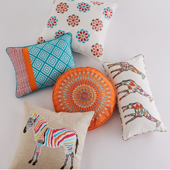 50+ Easy DIY Crafts to Sell and Make Extra Money Easy DIY crafts to sell: A collection of colorful, decorative throw pillows featuring floral medallions, geometric patterns, mandalas, and animal designs.