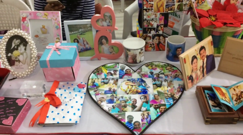 50+ Easy DIY Crafts to Sell and Make Extra Money Easy DIY crafts to sell: A display of personalized photo gifts on a table, including custom picture frames, a heart-shaped photo collage, printed mugs, decorated gift boxes, and small photo albums.