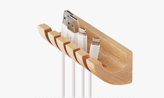 50+ Easy DIY Crafts to Sell and Make Extra Money Easy DIY crafts to sell: A wooden charging cable organizer block with parallel slots designed to hold and secure multiple USB and smartphone cords neatly in place.