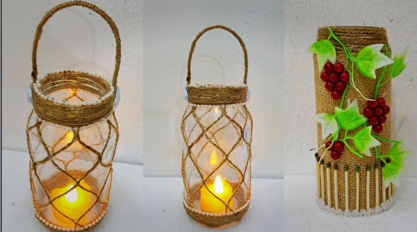Two glass jar lanterns wrapped in twine mesh with handles holding glowing candles, displayed alongside a twine-covered container decorated with artificial grapes for DIY crafts using things you have at home.