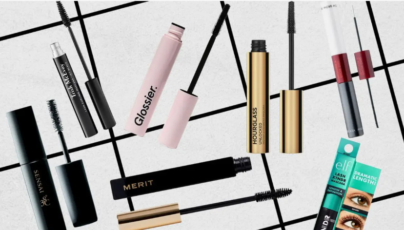 Flat lay of top-rated beauty products worth buying featuring various popular mascaras with wands displayed against a geometric background.