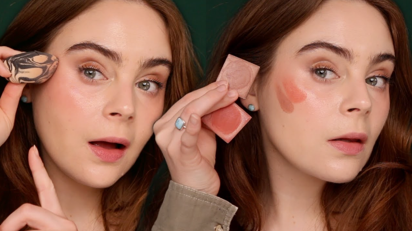 The Minimal Makeup Guide: How to Look Polished With Less Makeup A split-image showing a woman demonstrating makeup application, holding a makeup sponge on the left and blush compacts next to swatches on her cheek on the right.