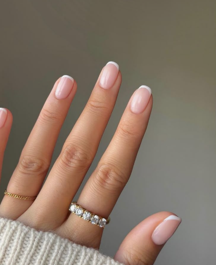 Clean, short French tip nails showcasing low-maintenance nail designs.