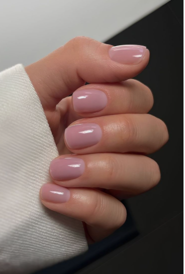 Glossy dusty pink short square nails showcasing low-maintenance nail designs.