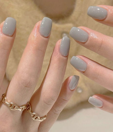 Glossy light gray short square nails showcasing low-maintenance nail designs.