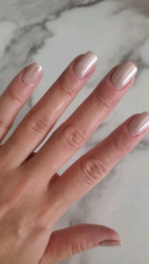 Glossy neutral beige glazed short square nails showcasing low-maintenance nail designs.