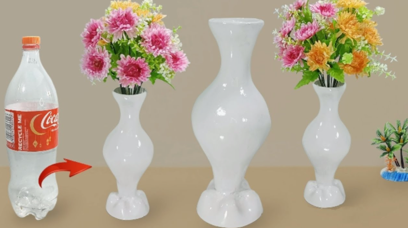 A plastic Coca-Cola bottle shown transforming into a sleek white decorative vase filled with colorful flowers.