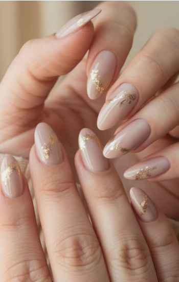 15 Stunning 3D Nail Designs to Try This Season Sophisticated 3D nail designs featuring delicate metallic gold foil accents and abstract textures over a neutral nude almond-shaped manicure.