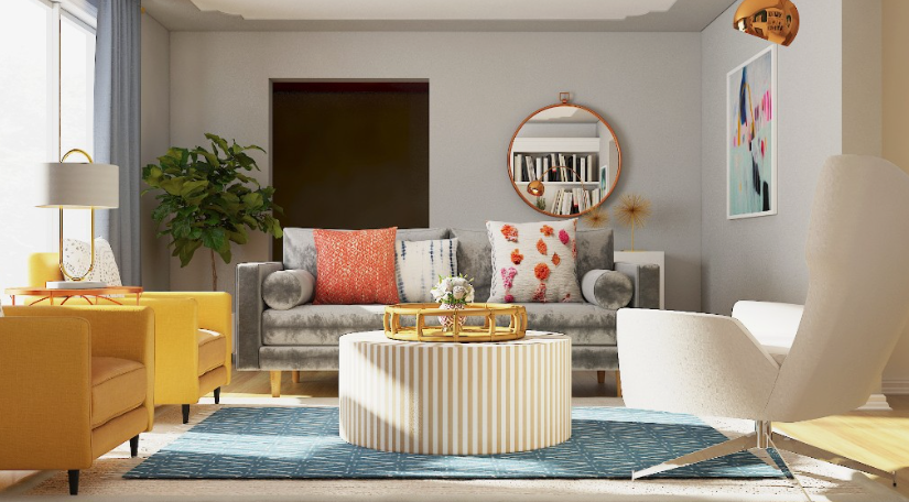 A modern living room featuring a grey velvet sofa with patterned throw pillows, yellow armchairs, a round striped coffee table on a blue rug, and eclectic wall art, showcasing a creative approach to how to decorate when everything doesn't match.