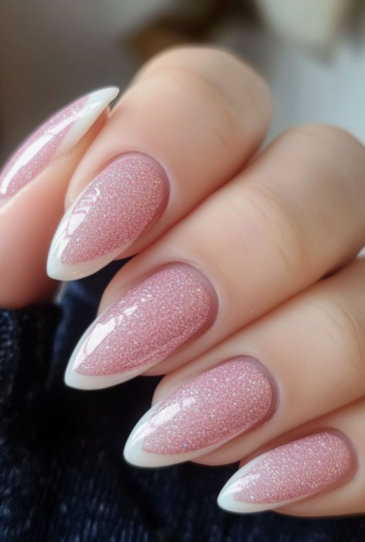 Almond-shaped shimmering pink cat-eye nails with crisp white French tips, blending elegance into office-friendly nail designs.