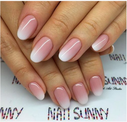 Short oval baby boomer nails featuring a soft pink and white ombre gradient, ideal for subtle office-friendly nail designs.
