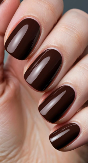 Short dark espresso brown glossy nails, delivering a rich yet professional aesthetic for office-friendly nail designs.