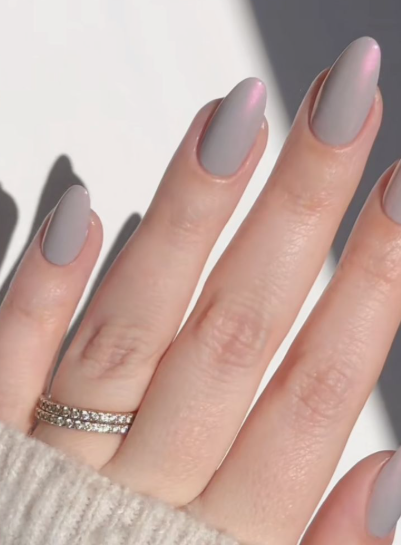 Medium oval greyish-mauve nails with a subtle chrome sheen, bringing an understated elegance to office-friendly nail designs.