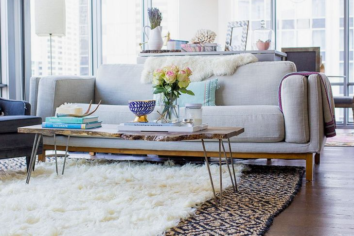 How to Make a Boring Room Look Better: 15 Simple Fixes Modern light-filled living room featuring a cozy white sofa, a live-edge wooden coffee table with hairpin legs, and a plush layered rug, illustrating chic ideas on how to make a boring room look better.