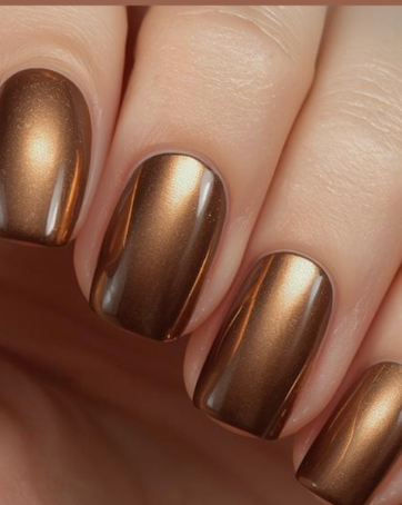 25 Short Fall Nail Ideas for 2026: Chic, Classy & Easy Designs Short fall nail ideas featuring glossy metallic bronze and copper cat-eye magnetic polish on short square-shaped nails.